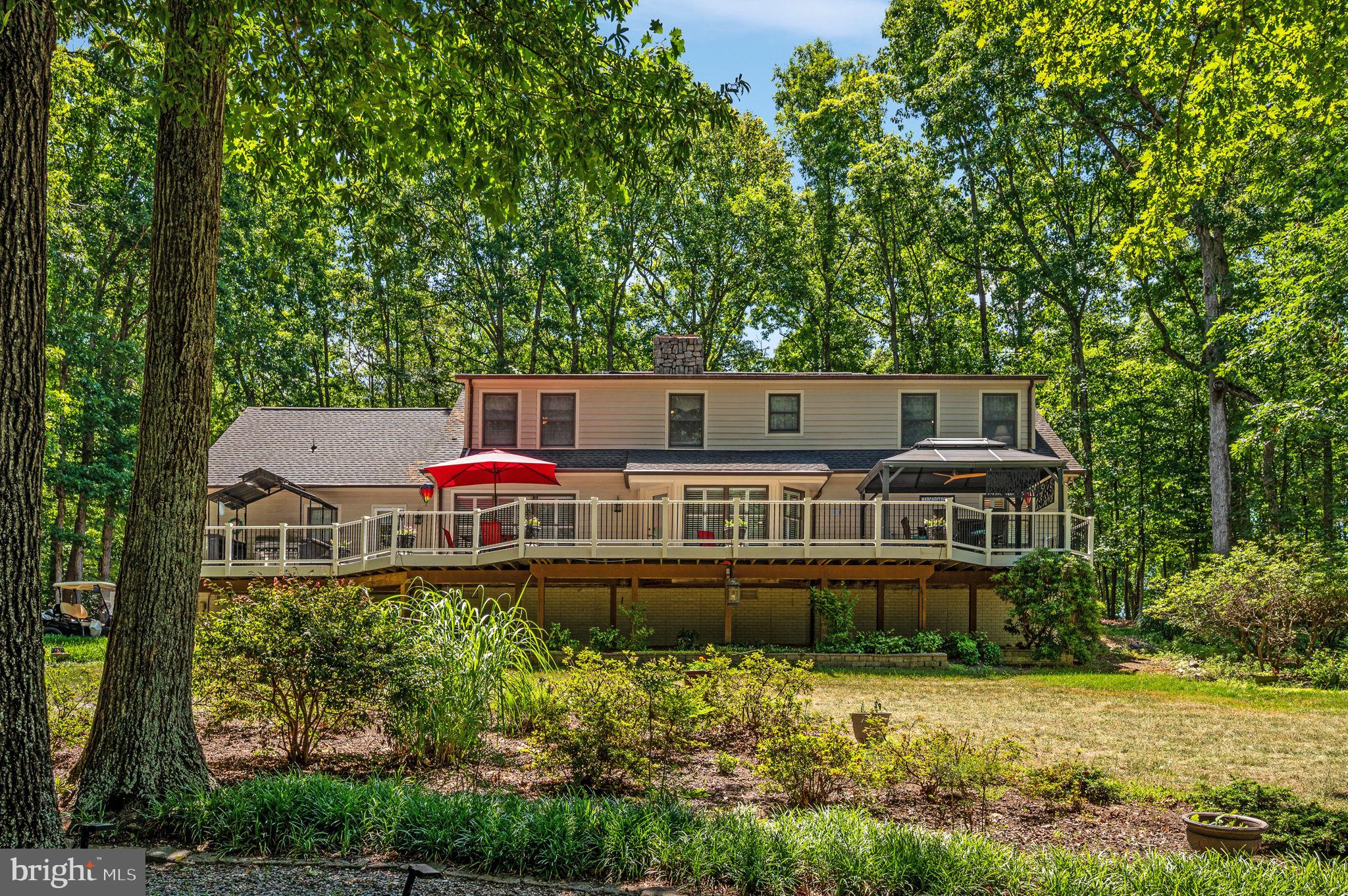 11105 Waddell Road Bumpass, VA 23024 - Photo 66 of 76 front view of a house with a yard