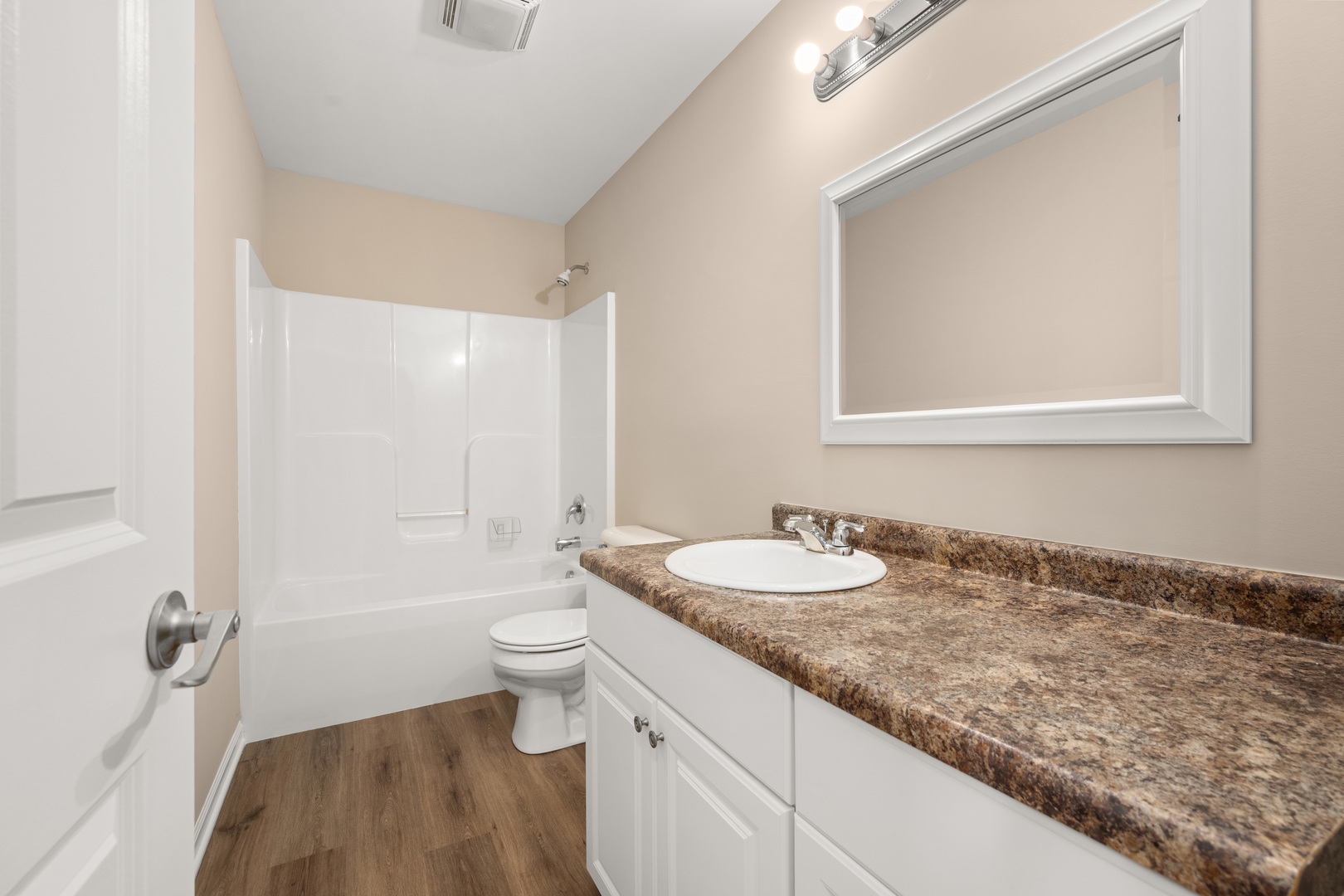3705 Green Tree Lane DeKalb, IL 60115 - Photo 23 of 31 a bathroom with a granite countertop sink a toilet and a mirror
