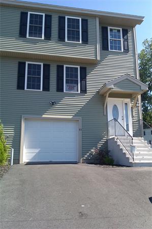 83 Massasoit Road Worcester, MA 01604 - Photo 1 of 10 a front view of house with a yard and garage