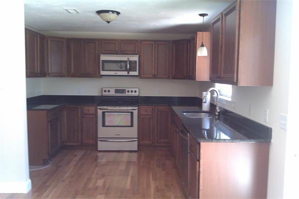 83 Massasoit Road Worcester, MA 01604 - Photo 3 of 10 a kitchen with appliances and cabinets