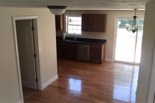 83 Massasoit Road Worcester, MA 01604 - Photo 4 of 10 a kitchen with granite countertop wooden floors and a sink