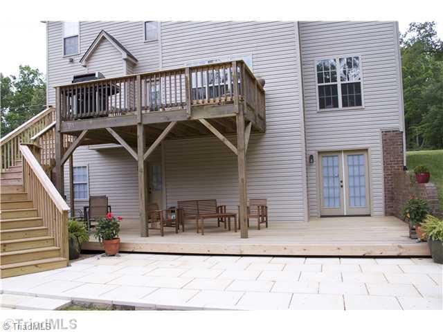 931 Williams Road Lewisville, NC 27023 - Photo 13 of 15 Exterior Back. Unfinished daylight basement with endless possibilities
