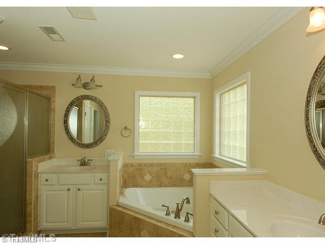 931 Williams Road Lewisville, NC 27023 - Photo 10 of 15 Master Bath/Spa. Dual vanities, all tile shower, jetted tub, water closet