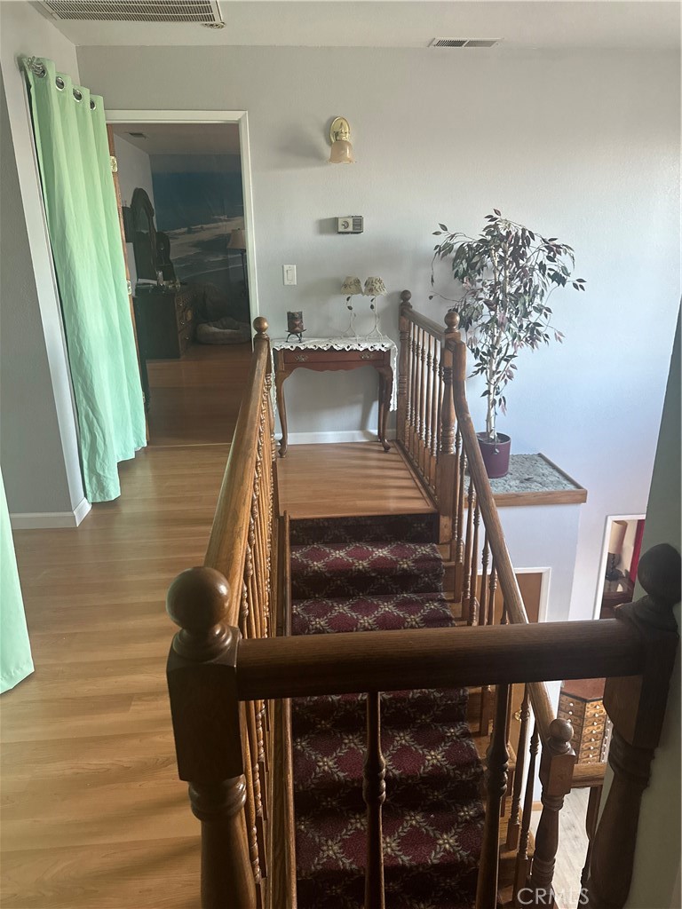 22085 Finnell Avenue Corning, CA 96021 - Photo 20 of 68 a view of entryway and hall with wooden floor
