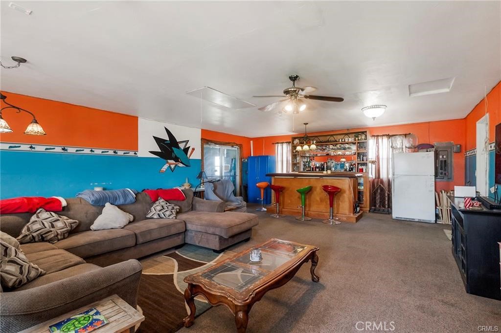 22085 Finnell Avenue Corning, CA 96021 - Photo 38 of 68 a living room with furniture kitchen and a chandelier
