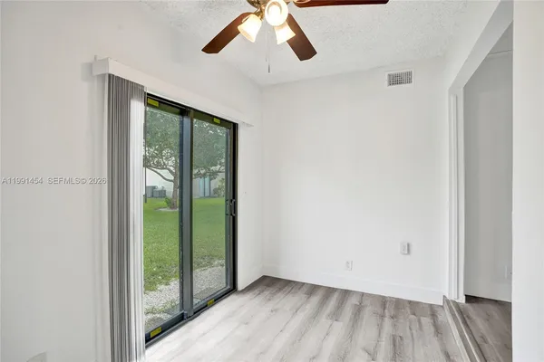 a view of an empty room with a window