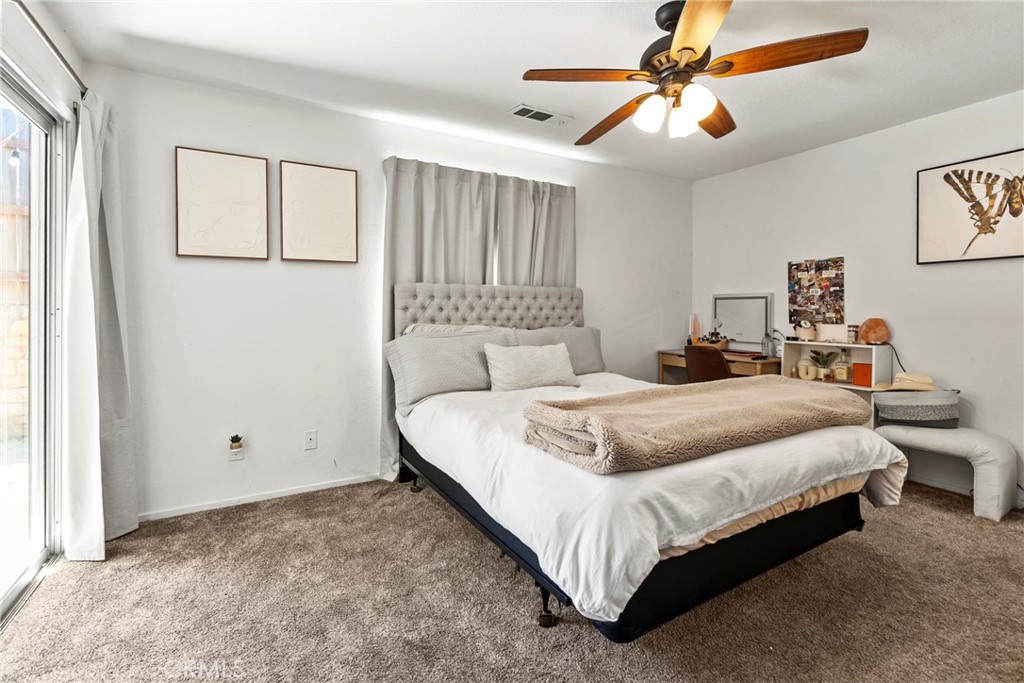 282 Robles Road, Unit 19 Arroyo Grande, CA 93420 - Photo 11 of 24 a bedroom with a bed and window