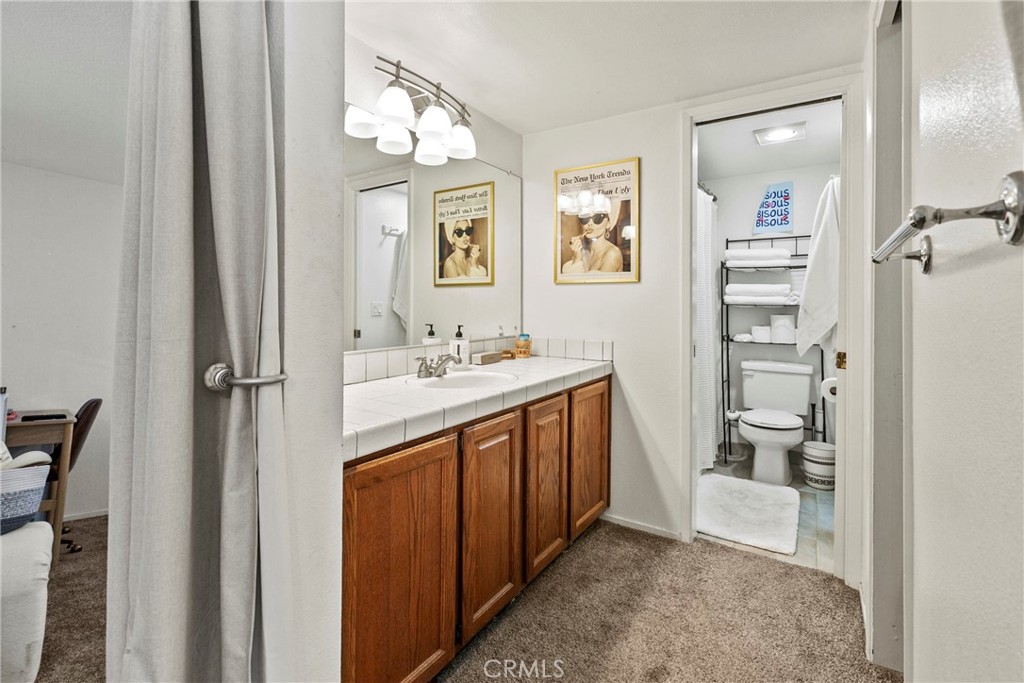 282 Robles Road, Unit 19 Arroyo Grande, CA 93420 - Photo 13 of 24 a bathroom with a sink a toilet and shower