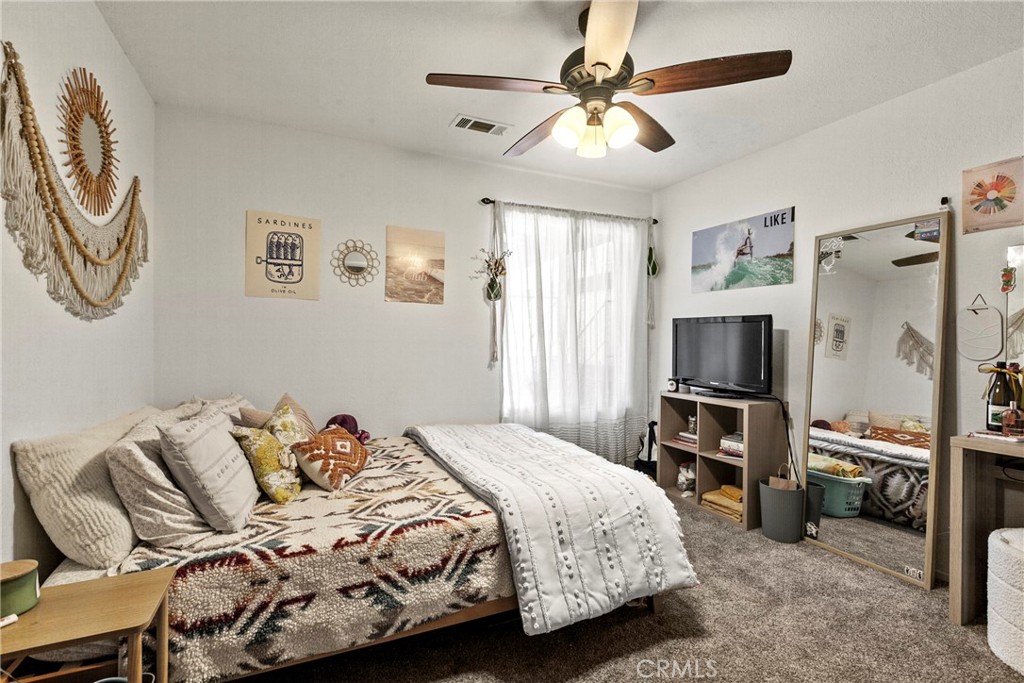 282 Robles Road, Unit 19 Arroyo Grande, CA 93420 - Photo 9 of 24 a bedroom with a bed and a television