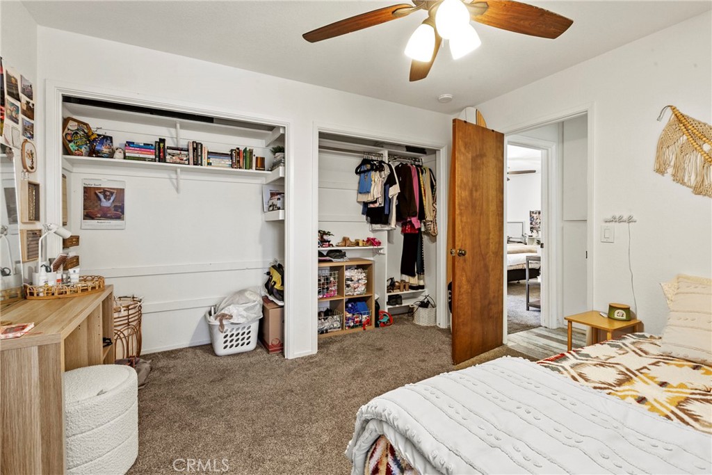 282 Robles Road, Unit 19 Arroyo Grande, CA 93420 - Photo 10 of 24 a bedroom with a bed and a couch