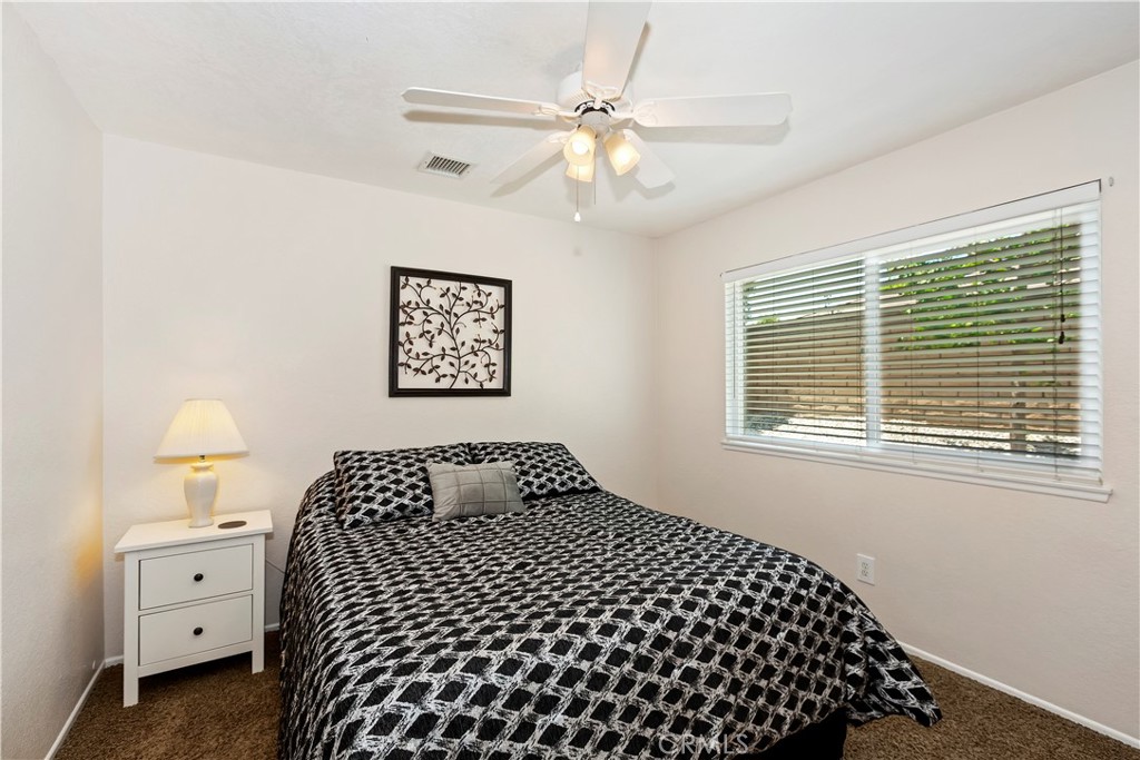 8527 Hillside Road Rancho Cucamonga, CA 91701 - Photo 24 of 50 a bedroom with a bed and a table
