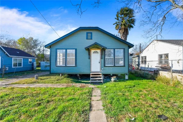 a house view with a garden space