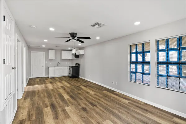 a view of a kitchen with a sink and dishwasher
