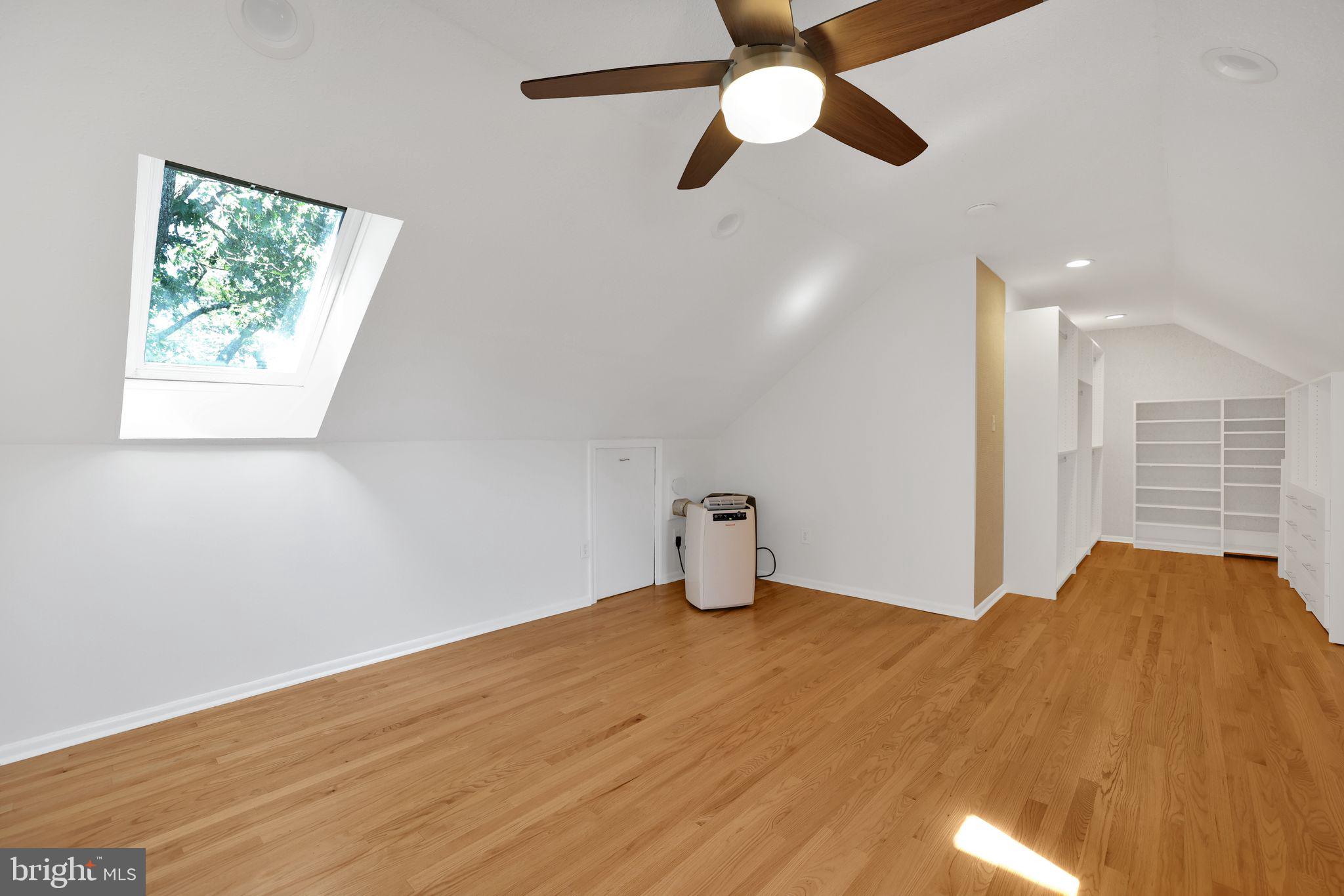 2312 Colston Drive, Unit 201 Silver Spring, MD 20910 - Photo 12 of 29 a bedroom with a bed and a chandelier