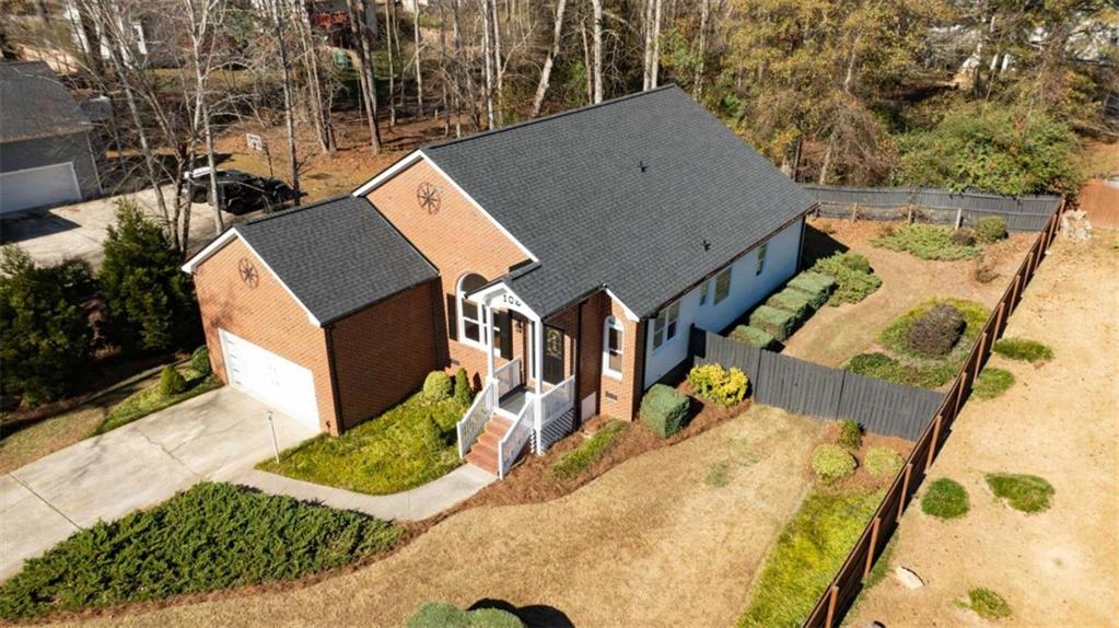 a aerial view of a house with a yard