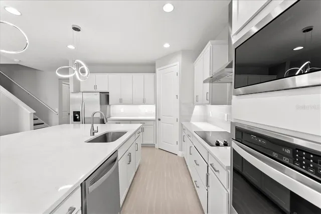 a kitchen with a stove and a sink