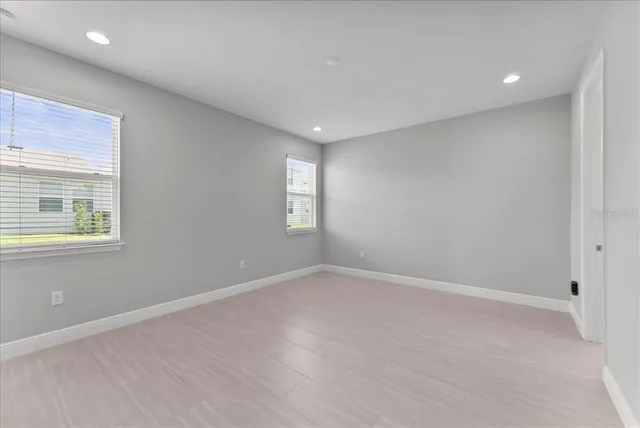 an empty room with windows