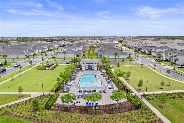 an aerial view of a house with a swimming pool