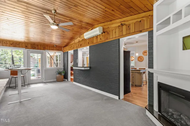 a bathroom with a granite countertop toilet a sink and a mirror
