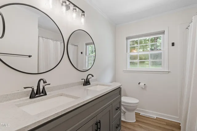 a bed room with a bed and a window