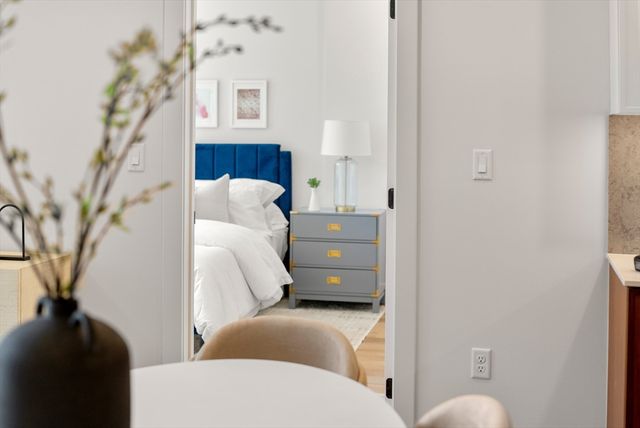 a living room with furniture and a toilet