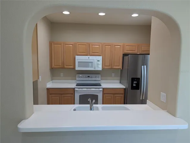 a view of a hallway with a bathroom