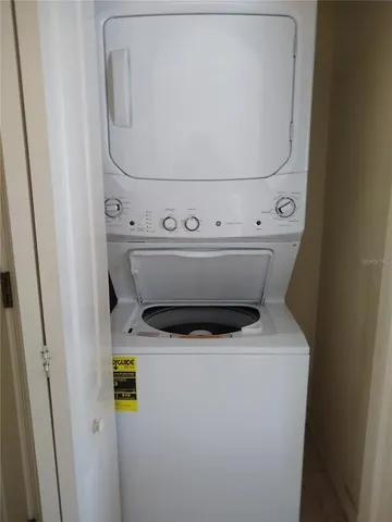 a kitchen with a sink and a refrigerator