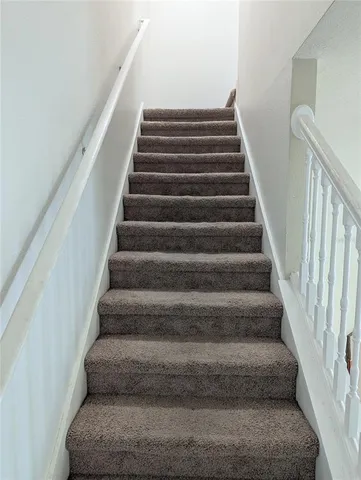 a bathroom with a toilet sink and shower