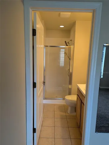 a close up of a light fixture and a kitchen