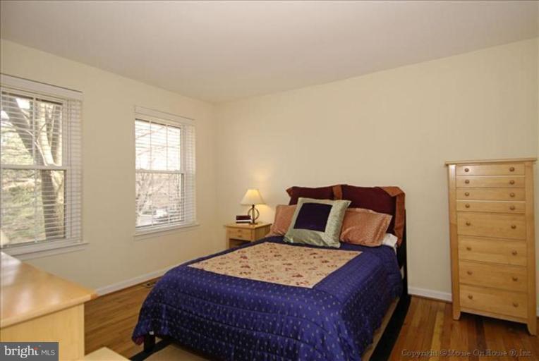2137 Golf Course Drive Reston, VA 20191 - Photo 12 of 26 a bedroom with a bed and a dresser