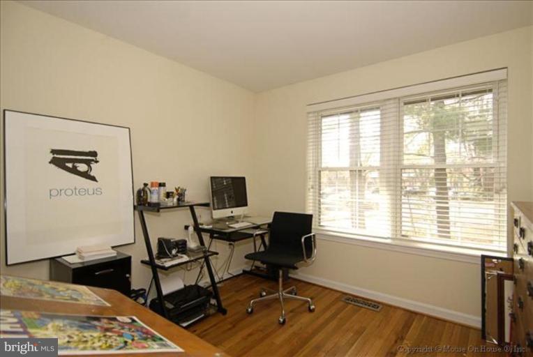 2137 Golf Course Drive Reston, VA 20191 - Photo 13 of 26 a view of a workspace with furniture and a window