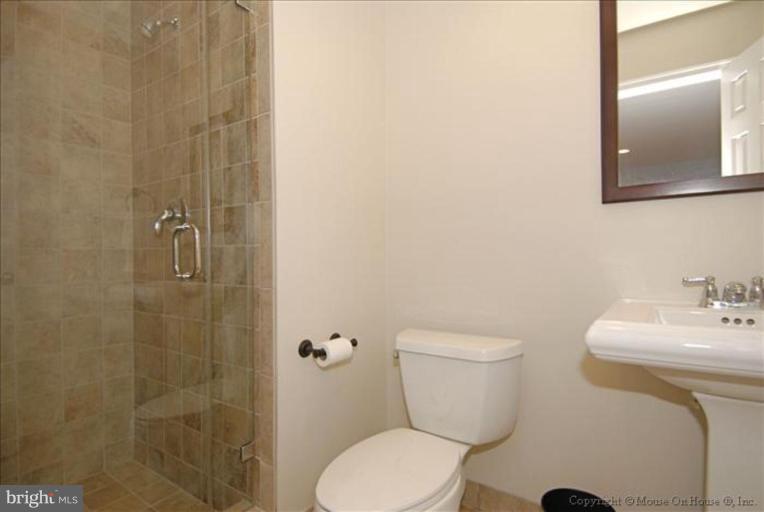 2137 Golf Course Drive Reston, VA 20191 - Photo 15 of 26 a bathroom with a sink a toilet and shower