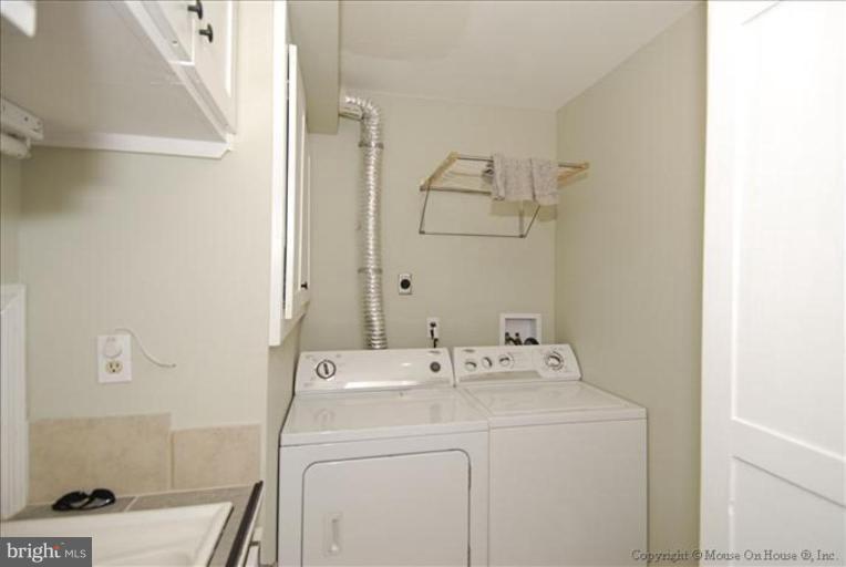 2137 Golf Course Drive Reston, VA 20191 - Photo 17 of 26 a utility room with dryer and washer