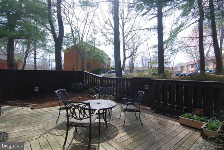 2137 Golf Course Drive Reston, VA 20191 - Photo 18 of 26 a view of a chairs and table on the deck
