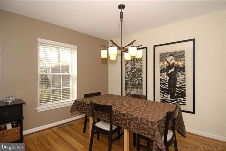 2137 Golf Course Drive Reston, VA 20191 - Photo 4 of 26 a view of a dining room with furniture window and wooden floor