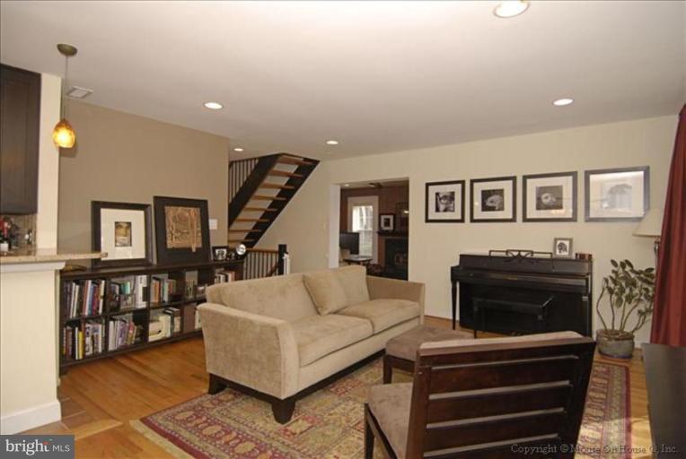 2137 Golf Course Drive Reston, VA 20191 - Photo 5 of 26 a living room with furniture and a fireplace