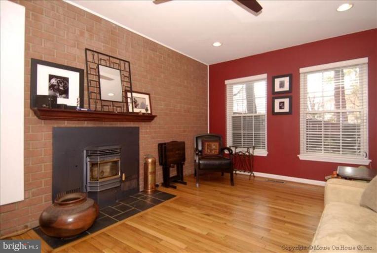 2137 Golf Course Drive Reston, VA 20191 - Photo 9 of 26 a living room with furniture and a fireplace