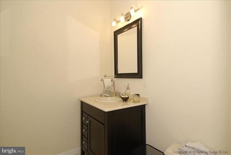2137 Golf Course Drive Reston, VA 20191 - Photo 10 of 26 a bathroom with a sink and a mirror