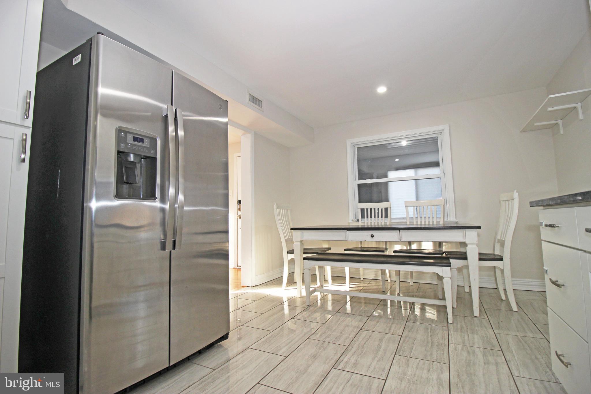 2748 Springhill Road Secane, PA 19018 - Photo 17 of 90 a kitchen with stainless steel appliances a stove a refrigerator and cabinets