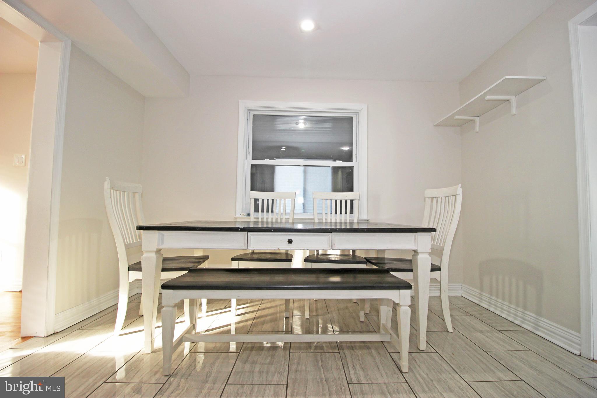 2748 Springhill Road Secane, PA 19018 - Photo 18 of 90 a living room with a table and chairs
