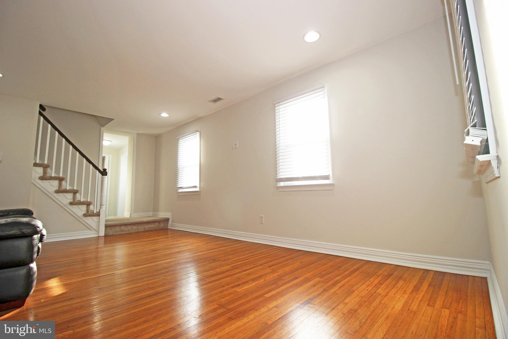 2748 Springhill Road Secane, PA 19018 - Photo 29 of 90 a view of an empty room with wooden floor and a window