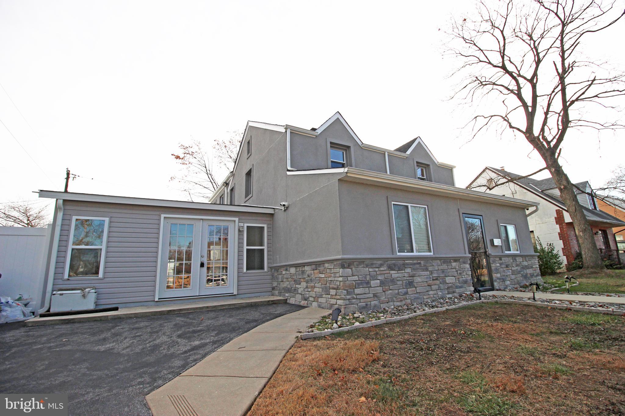 2748 Springhill Road Secane, PA 19018 - Photo 3 of 90 a front view of a house with a yard and garage