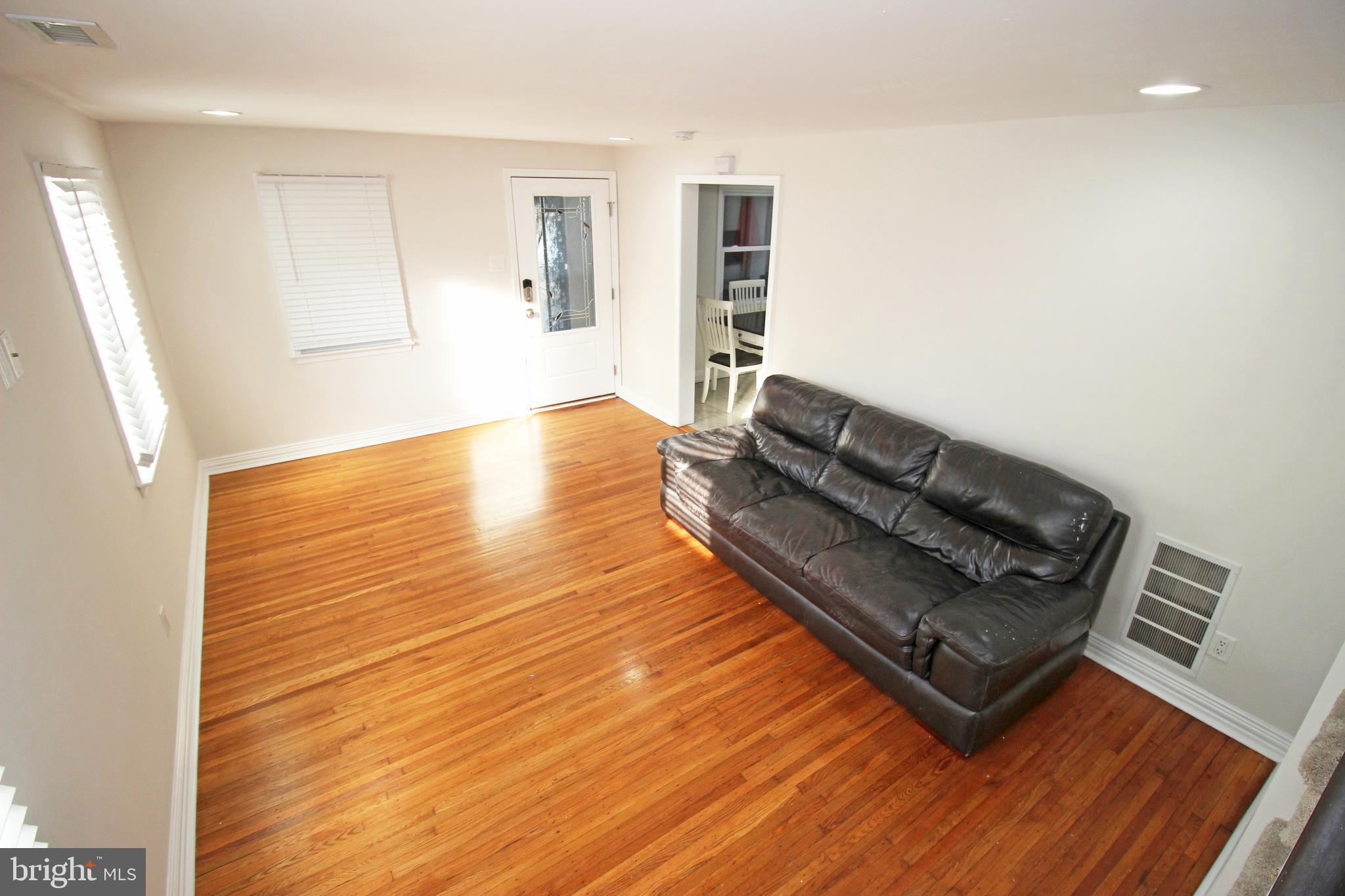 2748 Springhill Road Secane, PA 19018 - Photo 37 of 90 a view of an empty room with wooden floor and a window