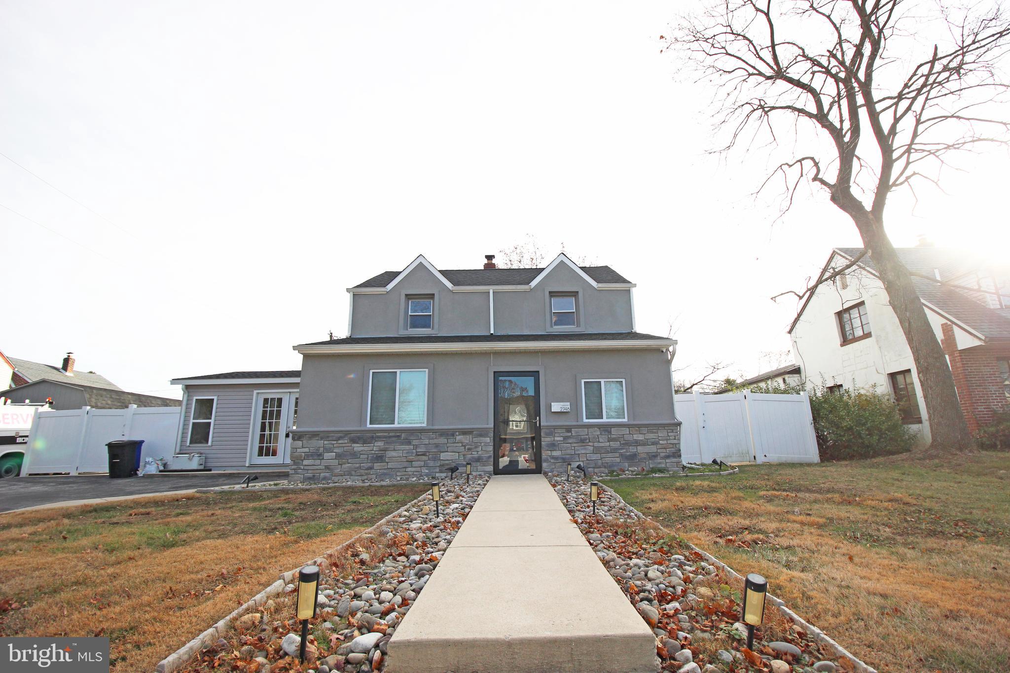 2748 Springhill Road Secane, PA 19018 - Photo 4 of 90 a front view of a house with a yard