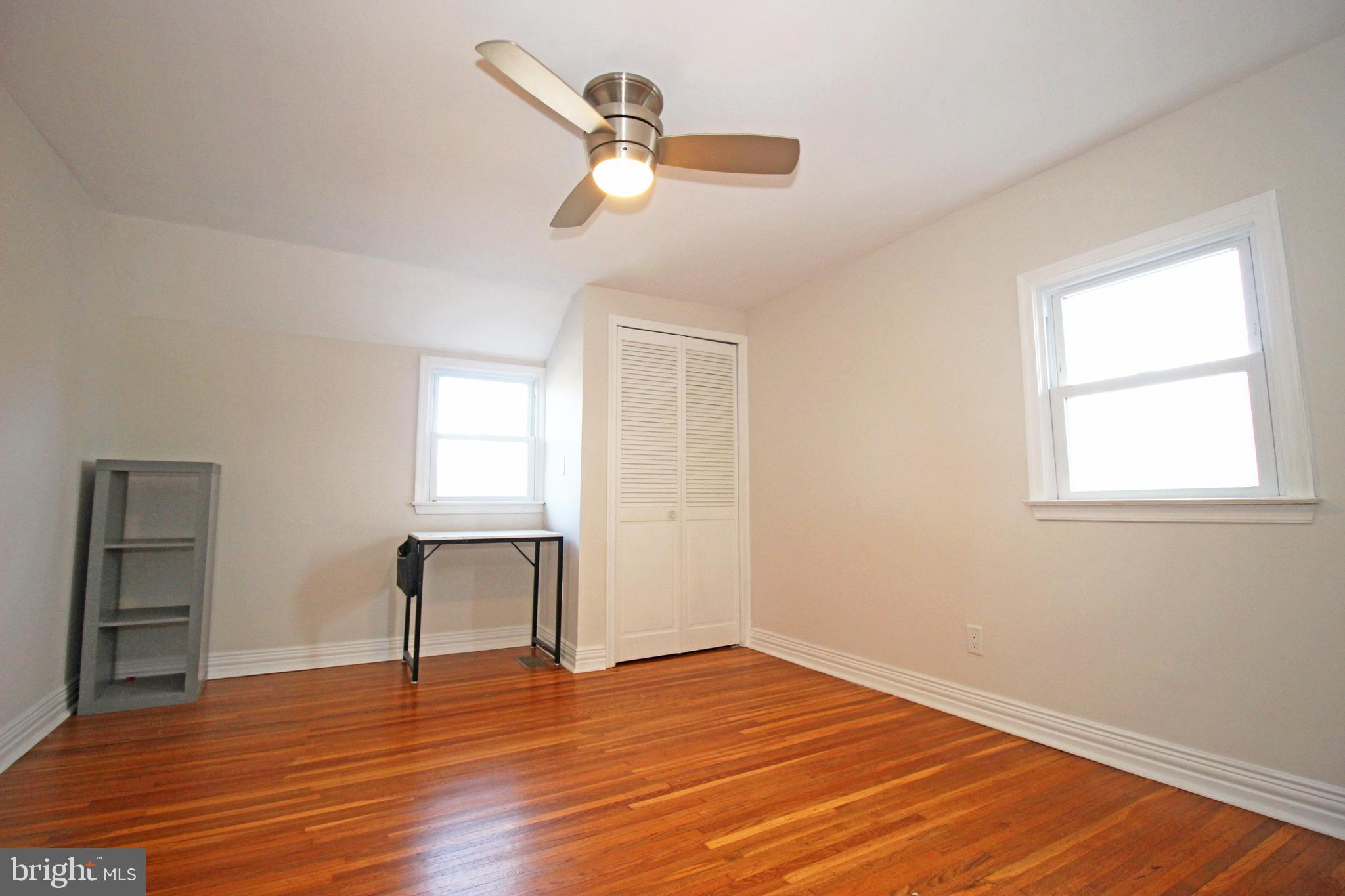 2748 Springhill Road Secane, PA 19018 - Photo 50 of 90 a view of empty room with wooden floor and fan