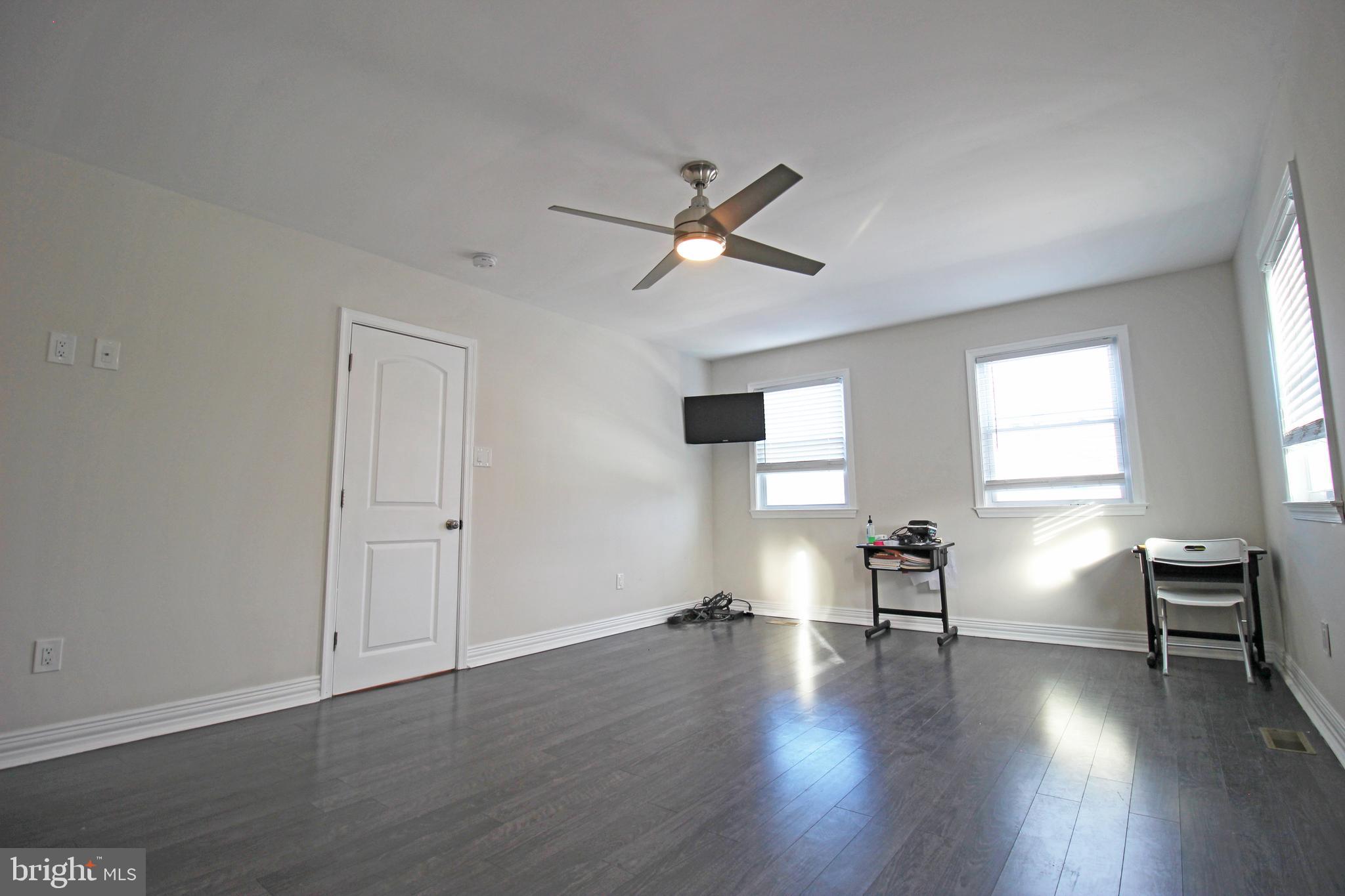 2748 Springhill Road Secane, PA 19018 - Photo 60 of 90 a view of empty room with wooden floor and fan