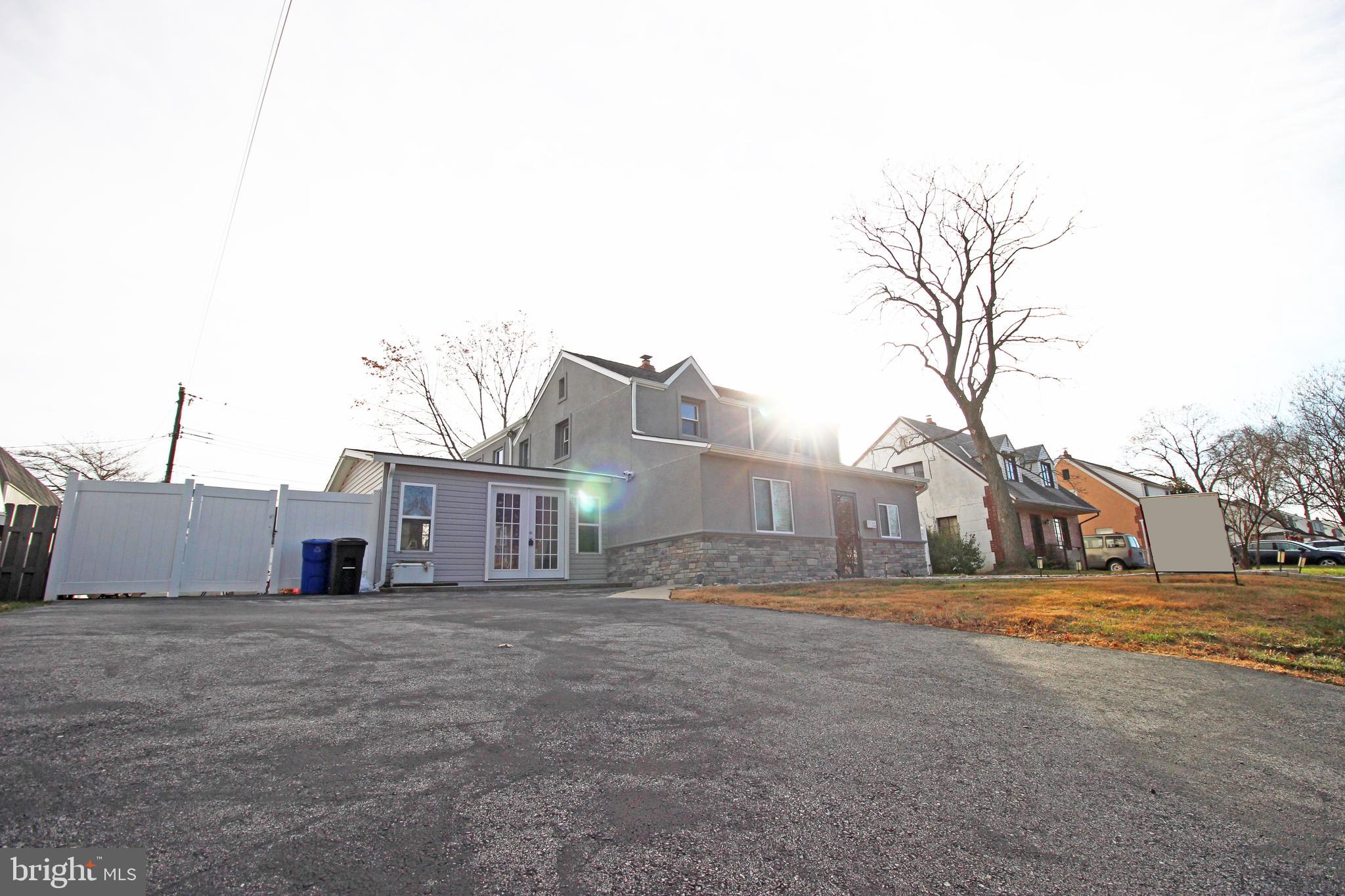 2748 Springhill Road Secane, PA 19018 - Photo 66 of 90 a view of a house with a big yard and large trees