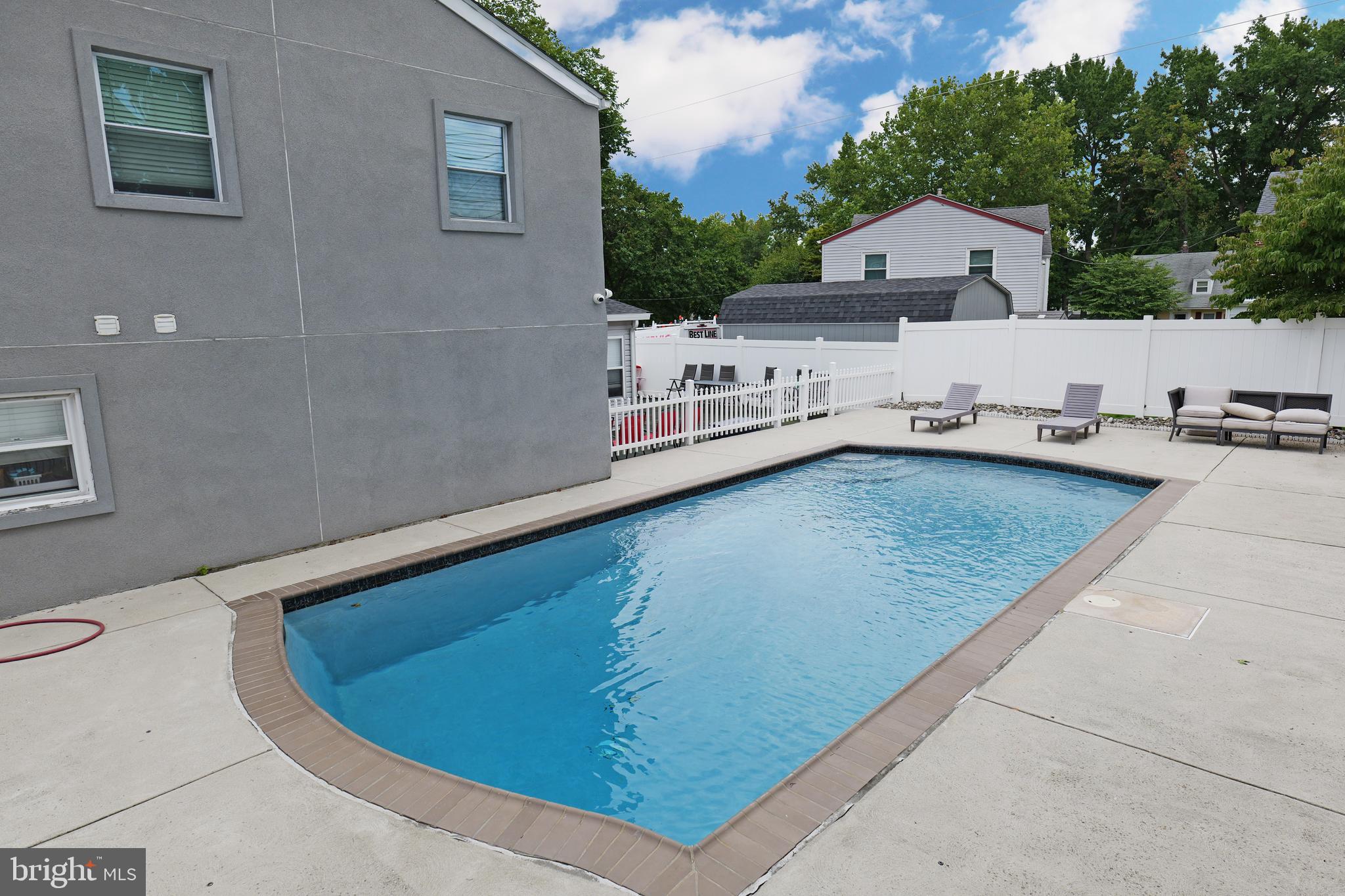 2748 Springhill Road Secane, PA 19018 - Photo 78 of 90 an aerial view of a house with swimming pool and wooden fence