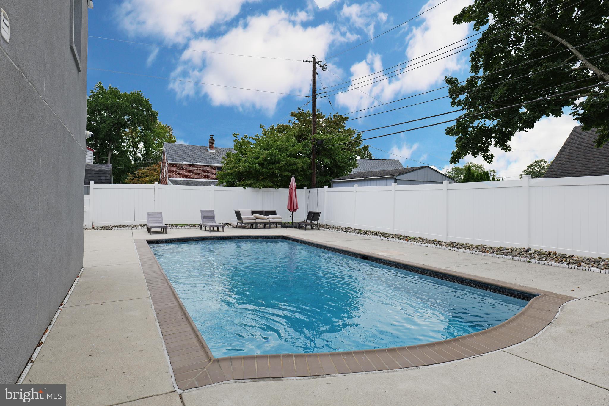 2748 Springhill Road Secane, PA 19018 - Photo 80 of 90 a view of a swimming pool with a lounge chairs