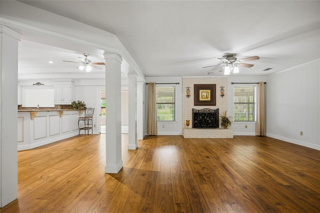 265 East Dove Road Southlake, TX 76092 - Photo 7 of 39 a view of a kitchen with wooden floor and a kitchen